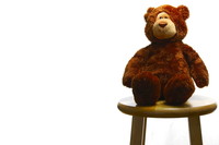 Teddy bear on a stool